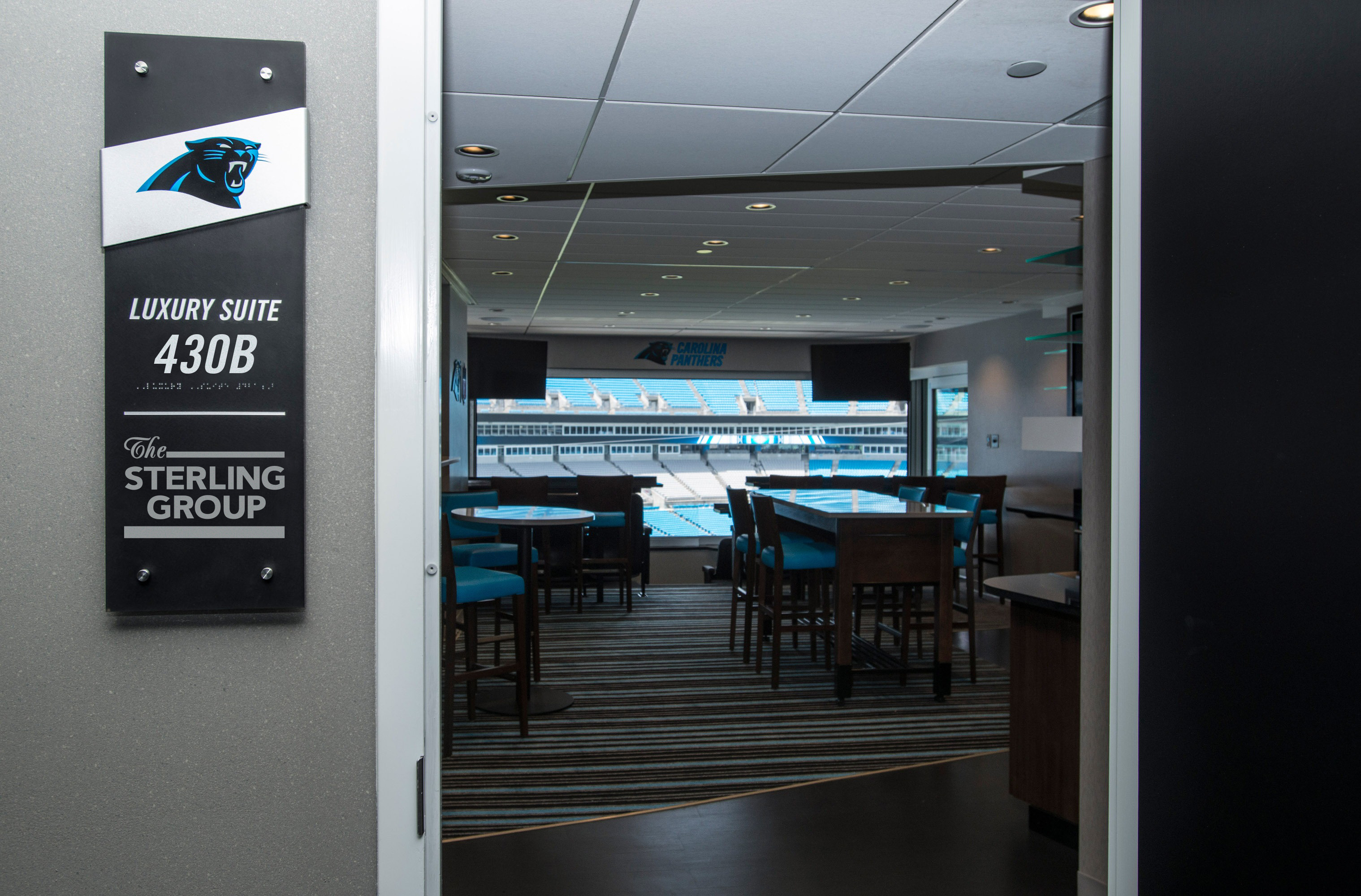 picture of The Sterling Group sign at entrance of luxury suite